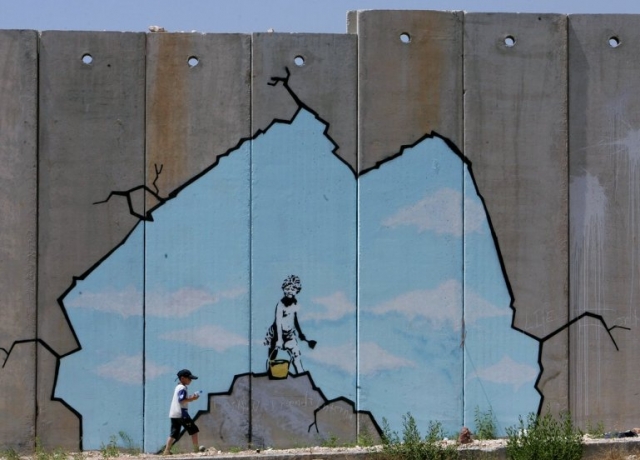 bansky-opening-the-apartheid-wall-in-palestine.jpg